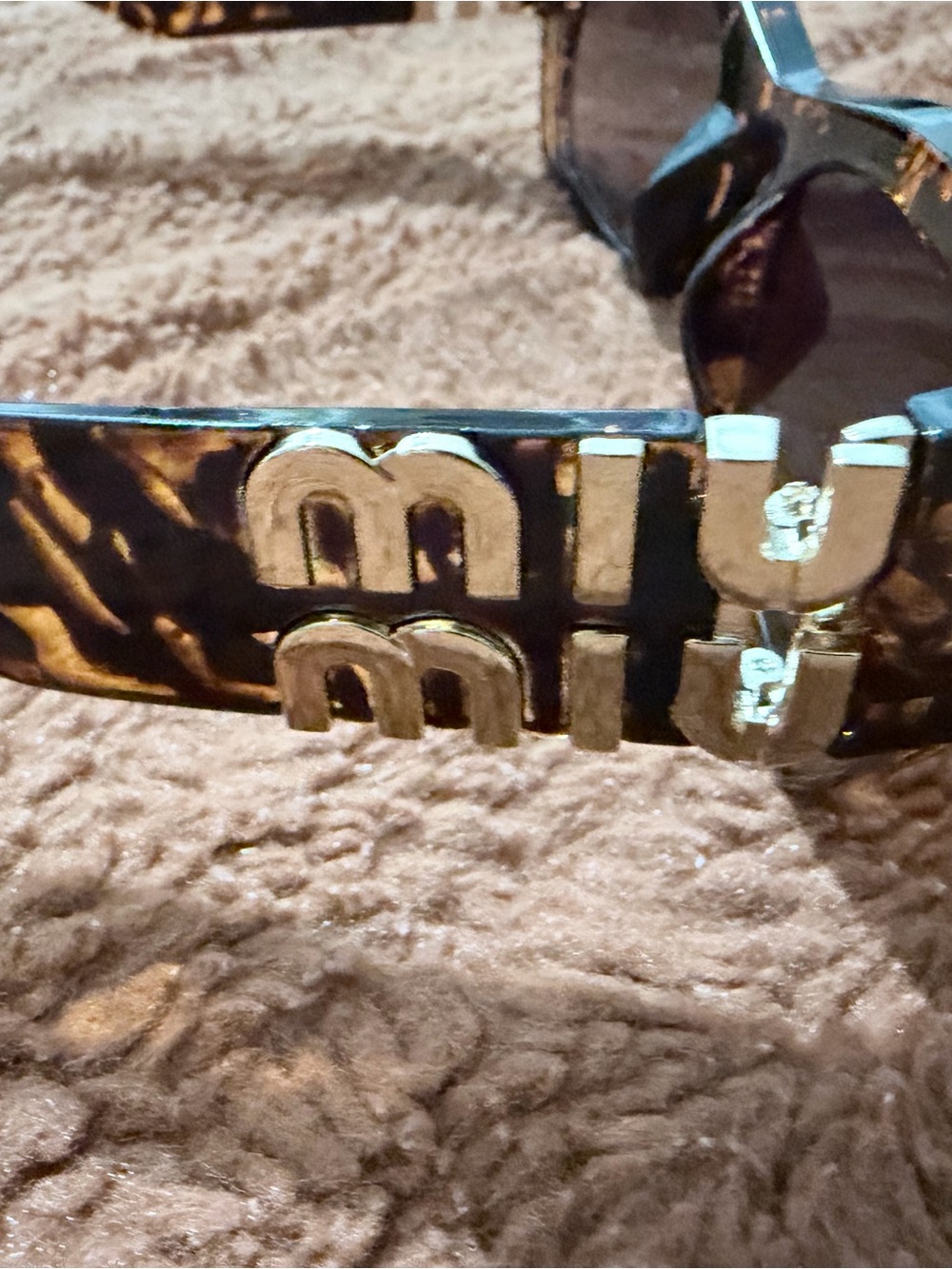 Miu Miu Tortoiseshell Sunglasses with Gold Logo Detailing